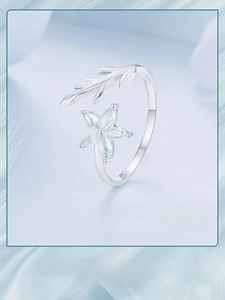 Detail of S925 sterling silver stamp and green petal flower design on adjustable ring
