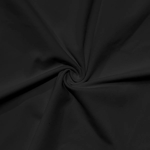 Macro detail of breathable black fabric showing smooth texture and high-quality weave