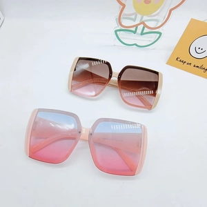Fashionable oversized square sunglasses for women with gradient lenses in brown and pink blue