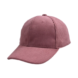 Detail view of pink corduroy texture and side profile on a classic baseball cap