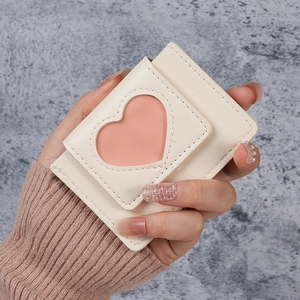 Minimalist cream white card holder with pink heart cutout and textured faux leather finish