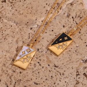 Gold celestial tarot necklace with sun and star rectangle pendants on natural stone