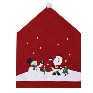 Detail of red Christmas chair cover featuring festive snowman and Santa Claus patterns