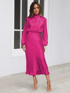 Detail view of fuchsia satin midi dress showing elegant high pleated neck and gathered waist