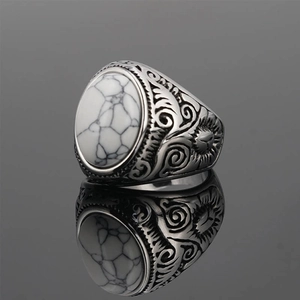 Vintage stainless steel ring with white turquoise stone and ornate silver engraving