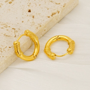 Golden stainless steel hoop earrings with vintage cloud pattern on beige stone