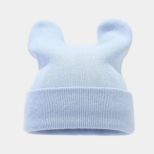 Detailed close-up of light blue knit hat featuring cute animal ear design and soft texture