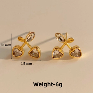 Macro shot of cherry-shaped earrings with heart-shaped crystals measuring 15mm in size