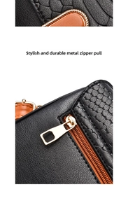 Detail of high-quality golden zipper puller on black and orange textured leather bag