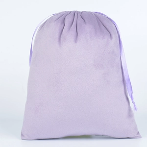 Detail of soft purple velvet drawstring bag with matching silk ribbon closure for jewelry
