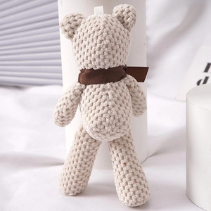 Cute beige knitted teddy bear plush keychain with a brown neck ribbon for bag accessories
