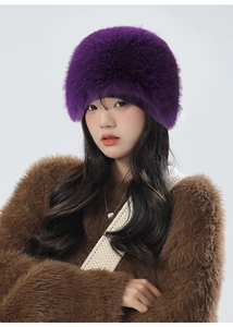 Detail of soft purple faux fur material on winter thermal trapper hat for women