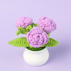Handmade crochet purple roses in a white ceramic pot for home office desk decoration