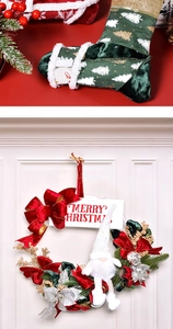 Detail of Christmas wreath with gnome doll and green festive stocking decoration