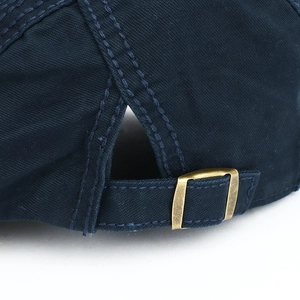 Classic navy cotton beret hat featuring an adjustable antique brass metal buckle for size