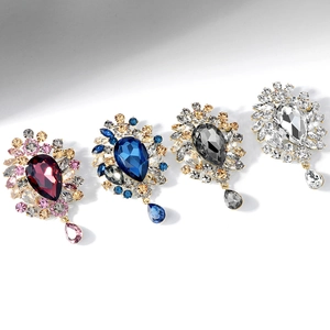 Luxury crystal brooches in four colors featuring teardrop pendants and sparkling rhinestones