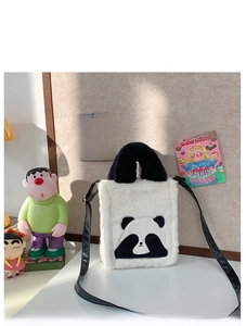 Detail of plush panda crossbody bag with Angry PANDA embroidery and soft white fur
