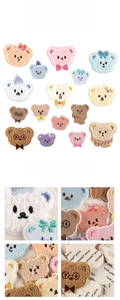 Macro detail of fluffy towel-textured cartoon bear patches showing soft embroidery and 3M adhesive