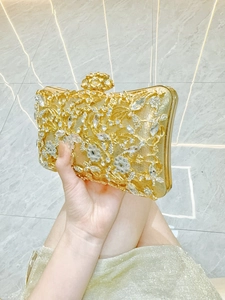 Elegant gold evening clutch bag with sparkling rhinestones and metal frame for women