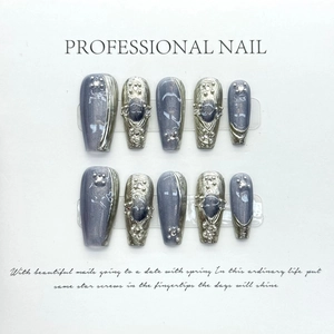 Handmade blue cat eye press-on nails with silver wire and rhinestones in a 10-piece set