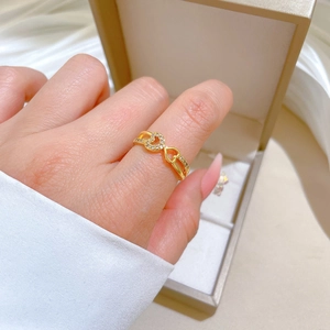 Gold plated heart ring with micro-set zircons on an elegant silk jewelry box display