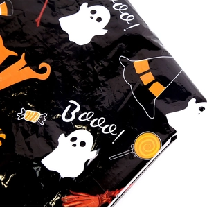 Close-up of Halloween PE tablecloth featuring ghosts, witch hats and Boo graphics