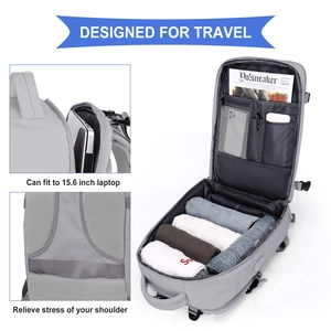 Gray travel backpack with 180-degree opening for clothes and a 15.6 inch laptop compartment