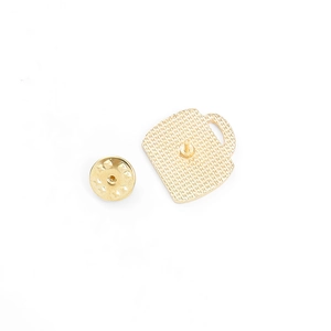 Golden alloy coffee cup brooch with textured metal butterfly clutch backings