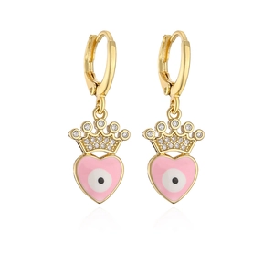 Detail of pink heart earrings with evil eye pattern and gold crown with small zircon
