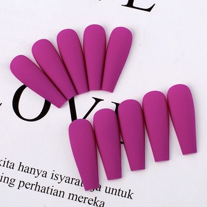 Detail of matte rose red coffin press on nails in various sizes on art paper