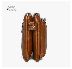 Side view of brown multi-layer crossbody bag showing leather texture and zipper compartments