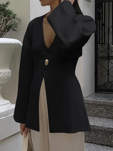 Elegant black knit cardigan for women with deep V-neck, single gold button and side slits