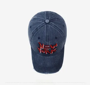 Top view of blue washed denim baseball cap with 3D New York embroidery and distressed brim
