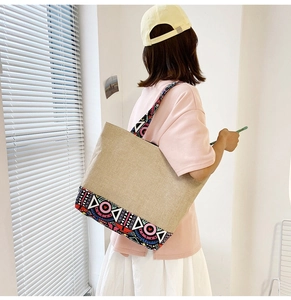 Detailed back view of a large linen tote bag with colorful geometric patterns