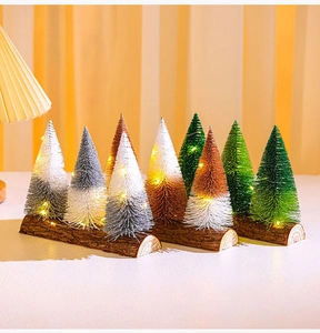 Miniature sisal Christmas trees with warm LED fairy lights on natural wooden bases