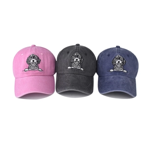 Vintage washed cotton baseball caps with dog embroidery in pink, charcoal, and navy blue