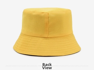 Rear view of ginger yellow cotton bucket hat with parallel stitching on the brim