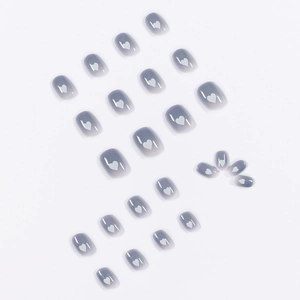 Blue-gray gradient press-on nails set with white heart patterns and glossy finish