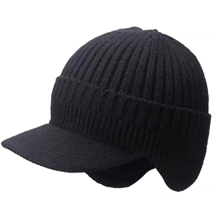 Detail view of black ribbed knit winter trapper hat with brim and warm ear flaps