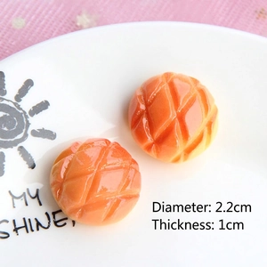 Detailed view of two resin pineapple buns measuring 2.2cm in diameter for DIY crafts