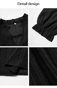 Detail view of black textured fabric top with elegant ruffle V-neck and flared cuffs
