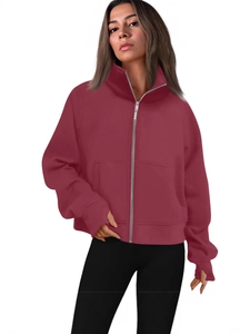 Women's deep red full-zip hoodie featuring functional thumb holes and a loose sporty fit