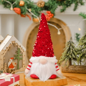 Gnome de Noël lumineux avec chapeau à paillettes rouges et barbe blanche soyeuse
