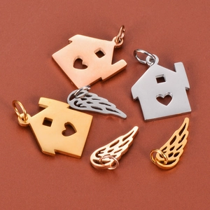 Polished stainless steel heart house and wing charms in gold, silver, and rose gold