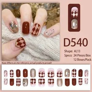 Press-on nails in coffee brown and red with diamond patterns and glitter finish