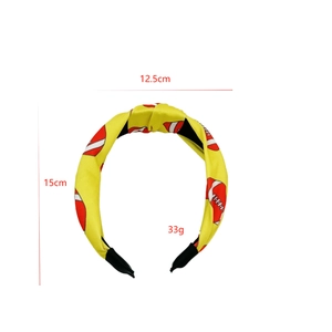 Yellow fabric headband featuring red rugby football prints with size and weight details
