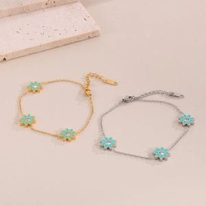 Ensemble de bracelets en acier titane avec fleurs en émail bleu et strass brillants
