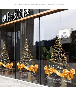 Golden ribbon Christmas tree window sticker with Merry Christmas text on glass storefront