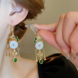 Modern Chinese style gold drop earrings with white jade buckle and green gemstone tassel