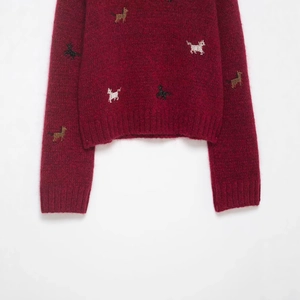 Deep red mohair knit sweater featuring colorful beaded animal patterns and ribbed cuffs